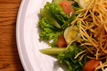 Ethical vegetarian or vegan meal. Boiled quail eggs in a spiralized fried potato french fries nest, Served with baby leaf salad. Healthy low calorie slimmer's meal made with a spiralizer.