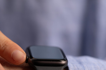 Close up of Businessman's hand looking at hand watch