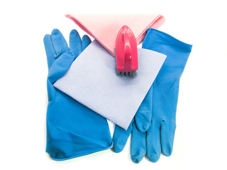 Cleaning kit isolated on white background. Set of wipes, rubber gloves and a brush. Professional kit for cleaning the house. 