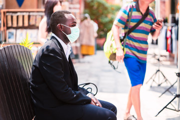 African businessman with medical mask for protect from corona virus or covid-19