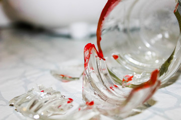 Bright broken shards with sharp edges smeared with blood.