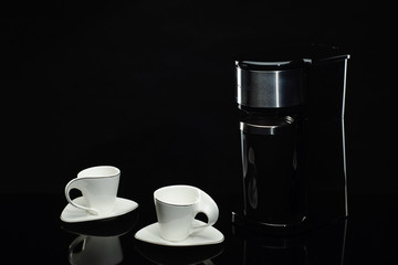 Espresso coffee machine on the black background