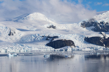 Fototapeta na wymiar Icebergs and mountains of the Antarctic Peninsula in the Gerlache Strait in the Danco Coast, Antarctica