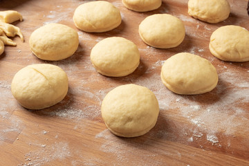 Fototapeta na wymiar Preparation of homemade doughnuts filled with marmalade