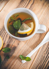 Tea cup of mint leaves with fresh slice lemon