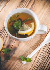 Tea cup of mint leaves with fresh slice lemon © Alen-D