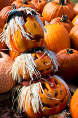 Three Jack-O-Lanterns in Halloween Pumpkin Display