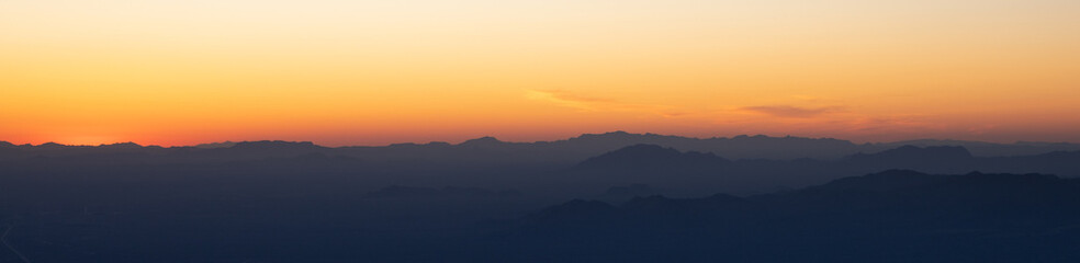 Sunset over Arizona mountain silhouettes 