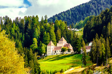 Castel Gardena (Fischburg) in a mountain forest. Santa Cristina Valgardena BZ, Italy.