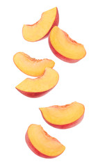 Fototapeta na wymiar Isolated cut peaches. Six pieces of fresh peach fruits in the air isolated on white background