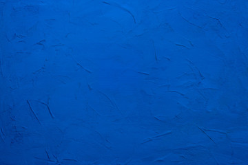 Abstraction blue background texture. Plastered painted wall.