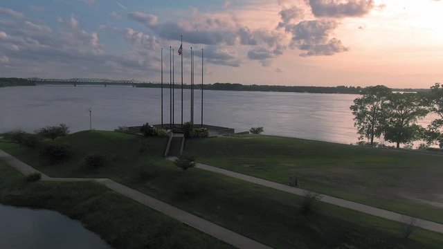 Aerial: American flag at Joe Curtis Point on Mud Island River Park, nestled on the Mississippi River. Memphis, Tennessee, USA. 