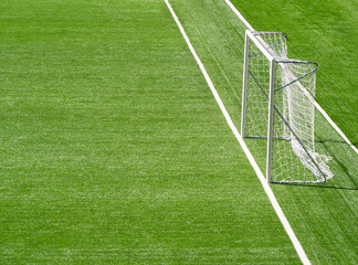 Portable goal post at football pitch background with copy space