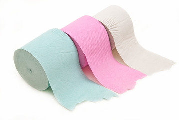 Toilet paper in three colors on a white background.