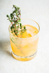 Old fahioned lemon beverage on the rustic background. Selective focus. Shallow depth of field.