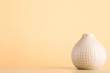 Ceramic vase on beige background