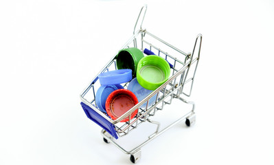 various dirty pet bottle caps in small shopping cart