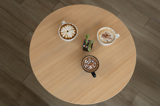 Coffee cups on table. Top view with cups of coffee and copyspace . 