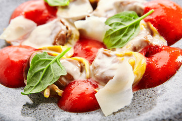 Ravioli with crab meat and tomato mousse close up