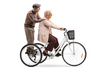 Elderly couple on a tricycle