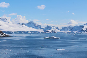 Fototapeta na wymiar Icebergs and mountains along the Gerlache Strait on the Danco Coast, Antarctica