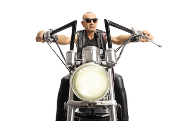 Fototapeta na wymiar Portrait of biker with sunglasses riding a custom motorbike