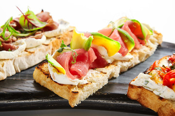Bruschetta with tuna and avocado closeup view