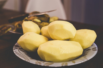 Peeling potatoes with a knife at home