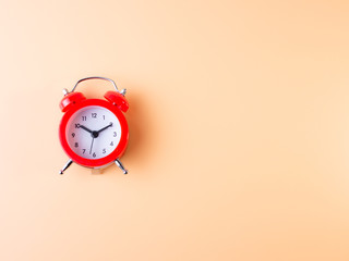red alarm clock isolated on yellow