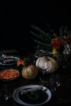 thanksgiving table with pies and dark styling