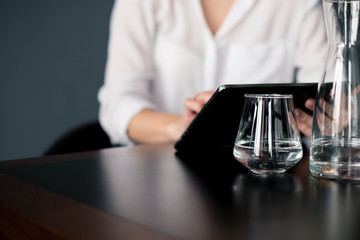 Businesswoman working on tablet at home