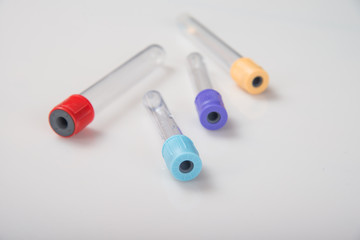 Blood tubes on a light background. The concept of blood testing.