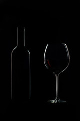 bottle and glass of red wine