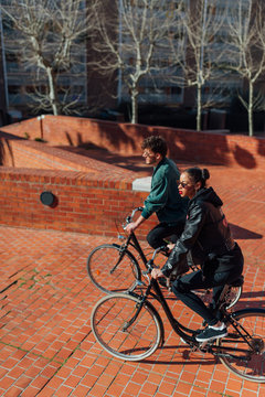 Urban Couple Riding Bikes