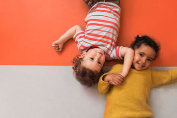 Adorable babies playing together in the kindergarten
