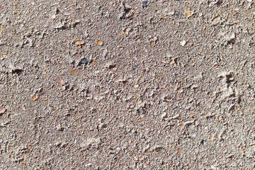 dirty grey concrete material with small stones for the background