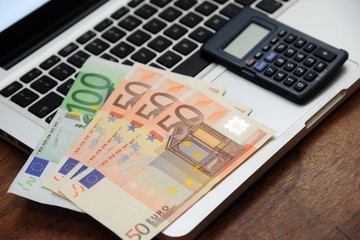 euro money and computer keyboard - economic transaction and bank on line shopping