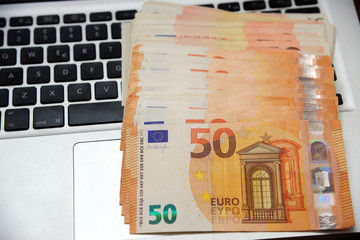 Fototapeta na wymiar euro money and computer keyboard - economic transaction and bank on line shopping