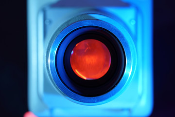 Old slide projector with slide frame photographed in the studio with flash light