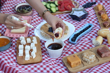 having a picnic and applying bread jam