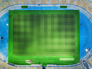 Drone view of stadium tribunes and field.