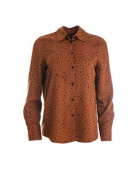 Elegant brown shirt on mannequin against white background. Women's clothes