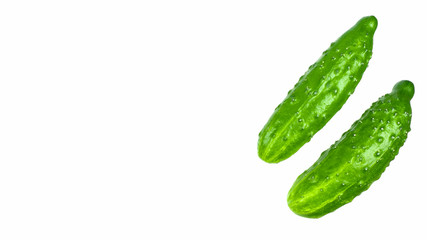 Green cucumbers on a white background isolate