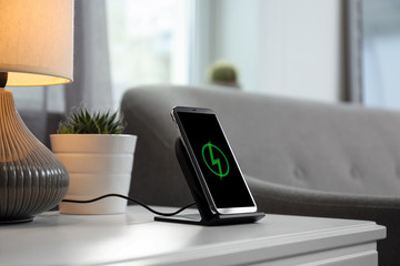 Smartphone charging on wireless pad in room