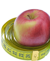 red apple with measuring tape isolated on white background