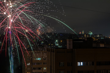 A closeup shot of festive fireworks spreading happiness in the night sky
