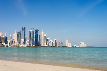 Fototapeta na wymiar View of city center with skyscrapers from the Beach in Doha, Qatar