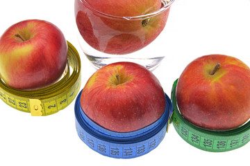 red apple with measuring tape isolated on white background