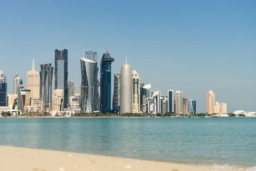 View of city center with skyscrapers from the other side of sea in Doha, Qatar