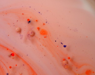 Abstract photography. Multicolored spheres, streaks and spots on a light background. Red, yellow,...